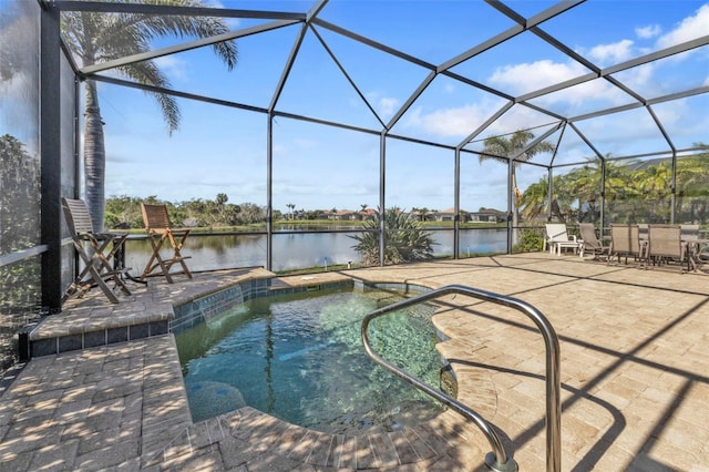 view of swimming pool featuring a lanai, a water view, and a patio