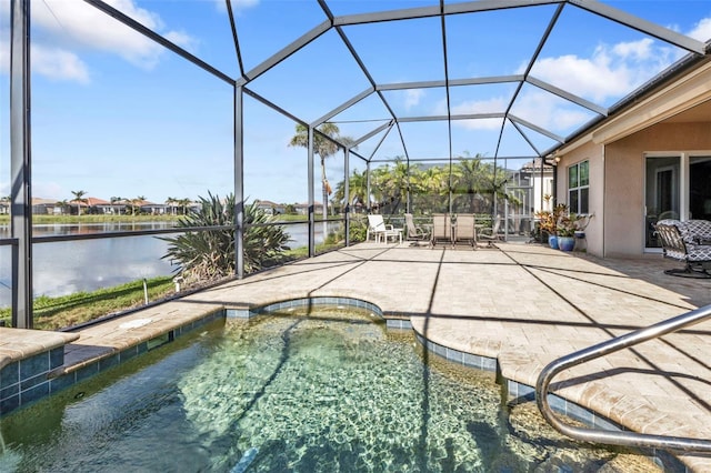 view of pool featuring a lanai, a water view, and a patio