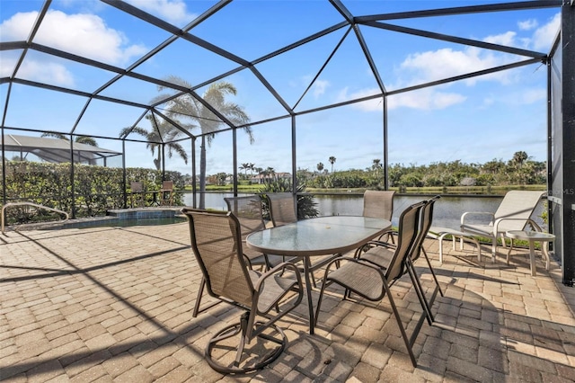 view of patio / terrace featuring glass enclosure, an outdoor pool, and outdoor dining space