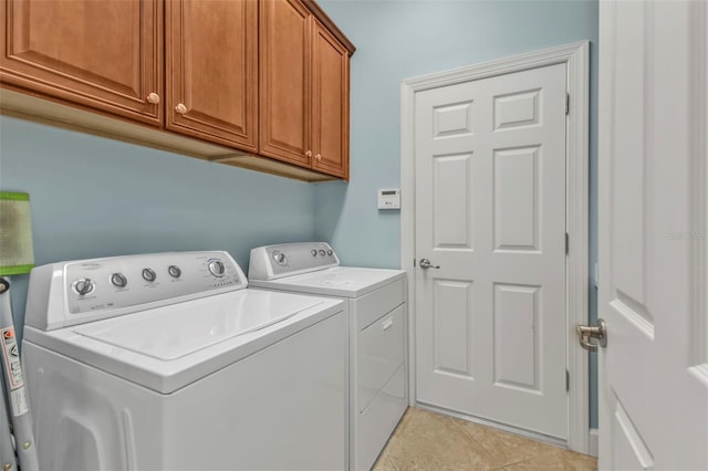 laundry area with cabinet space and washer and dryer