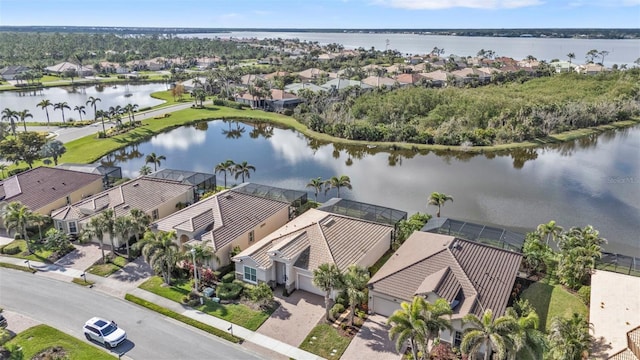 aerial view with a residential view and a water view