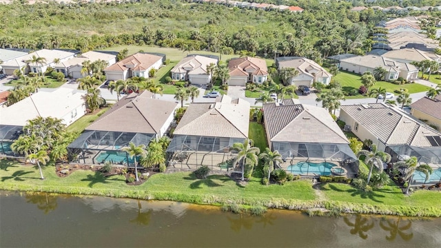 birds eye view of property with a residential view and a water view