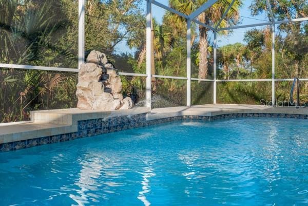 pool featuring glass enclosure