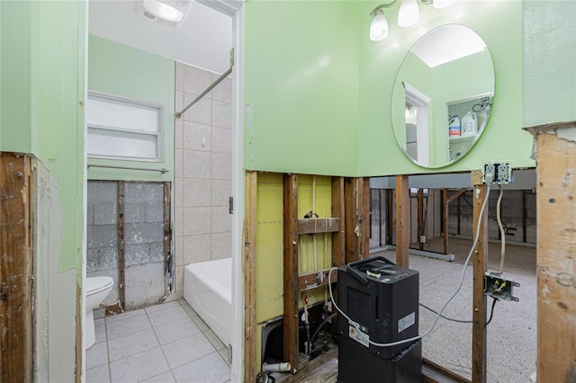 full bath featuring toilet, tub / shower combination, and tile patterned floors