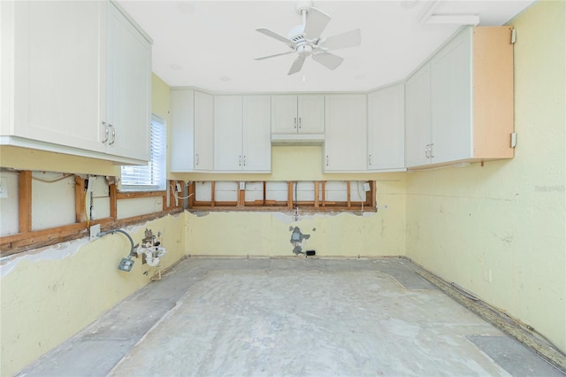 kitchen with white cabinets and a ceiling fan