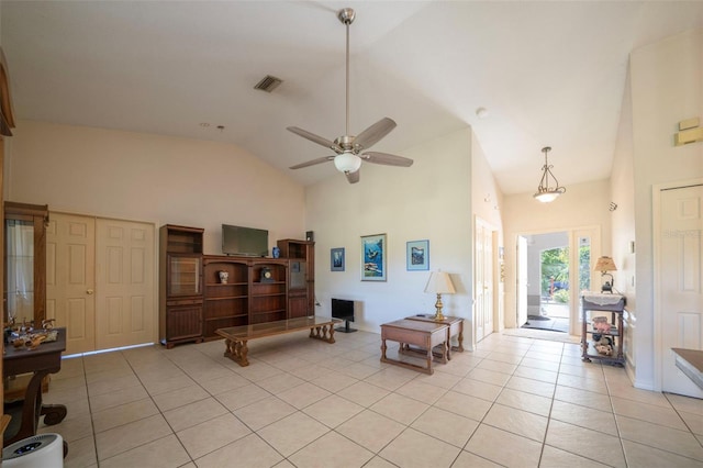 interior space with light tile patterned floors, a ceiling fan, visible vents, and high vaulted ceiling