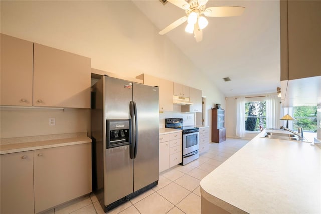 kitchen with light tile patterned floors, stainless steel appliances, light countertops, under cabinet range hood, and a sink