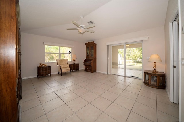 interior space featuring lofted ceiling, plenty of natural light, and light tile patterned floors