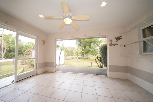 spare room with a ceiling fan, recessed lighting, and light tile patterned floors