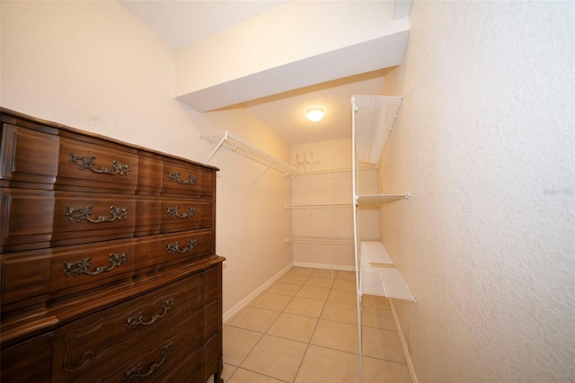 spacious closet featuring light tile patterned floors