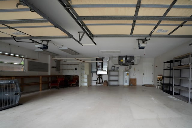 garage featuring water heater, central AC, and a garage door opener