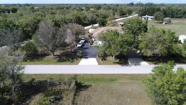 drone / aerial view featuring a forest view