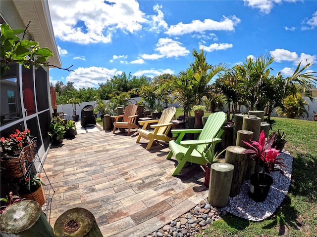 view of patio with a sunroom