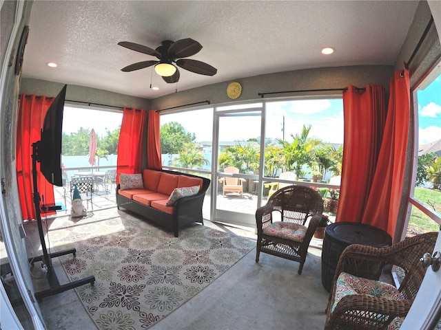 sunroom featuring a ceiling fan