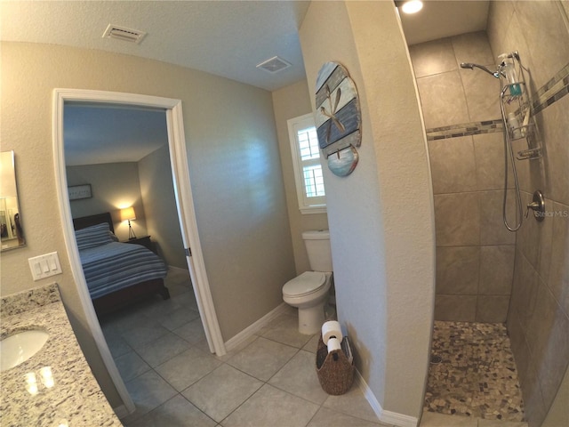 full bath featuring baseboards, visible vents, toilet, and walk in shower