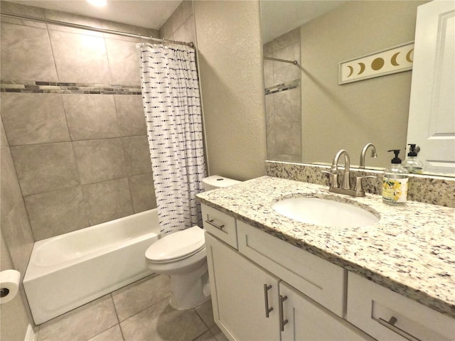 bathroom with a textured wall, toilet, tile patterned floors, shower / bathtub combination with curtain, and vanity
