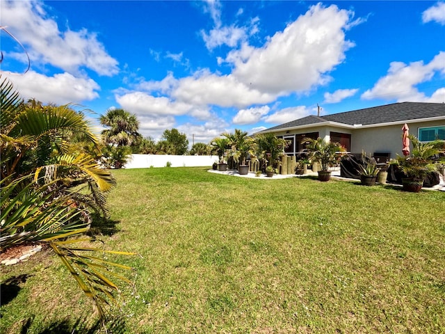view of yard with fence