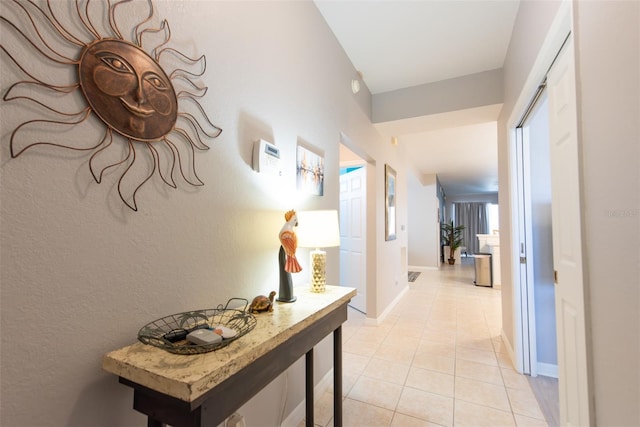 2002 Bal Harbor Blvd Unit 311, Punta Gorda, FL 33950 - hall with baseboards and light tile patterned flooring