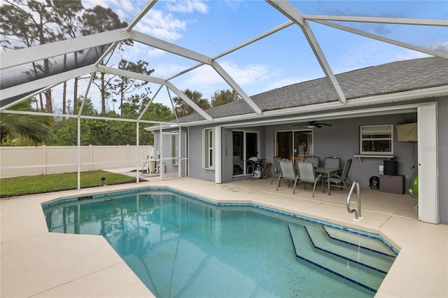 view of swimming pool featuring a patio, fence, a fenced in pool, and ceiling fan