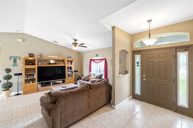 foyer entrance with vaulted ceiling, light tile patterned floors, baseboards, and visible vents