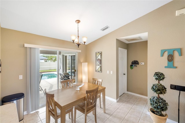 dining room featuring vaulted ceiling, light tile patterned floors, baseboards, and visible vents