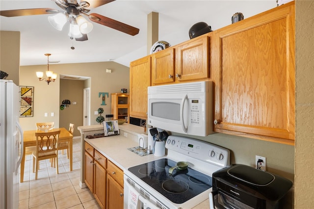 kitchen with ceiling fan with notable chandelier, white appliances, light countertops, light tile patterned floors, and lofted ceiling