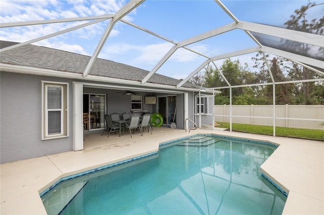 view of swimming pool featuring a fenced in pool, ceiling fan, a patio, and fence