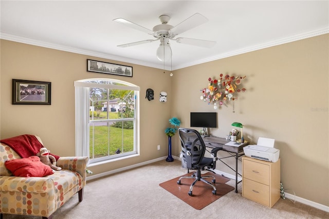 carpeted office space featuring crown molding, a ceiling fan, and baseboards