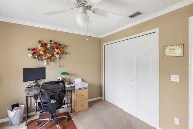 home office featuring baseboards, light colored carpet, visible vents, and ornamental molding