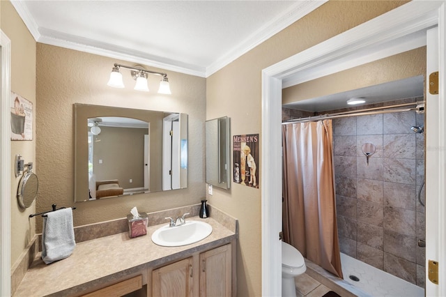 full bathroom featuring a stall shower, toilet, crown molding, and vanity