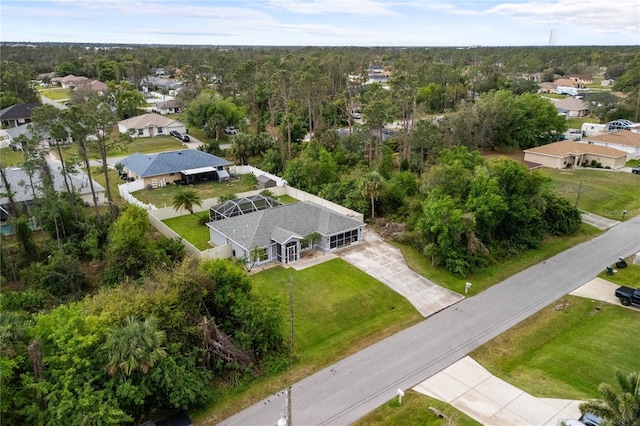 aerial view with a residential view and a view of trees