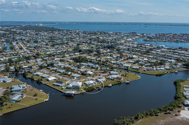 birds eye view of property featuring a water view and a residential view