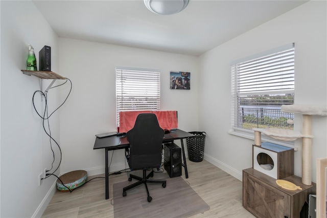 office area with wood finished floors and baseboards