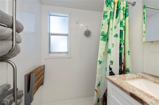 full bath featuring vanity and a shower with curtain