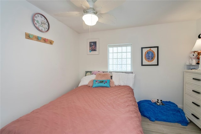 bedroom with a ceiling fan and light wood finished floors