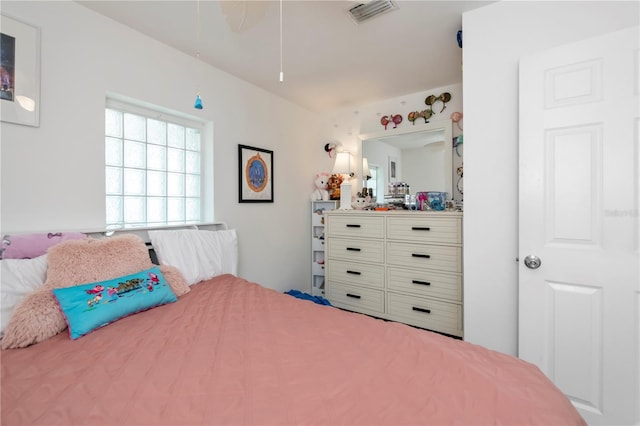 bedroom featuring visible vents