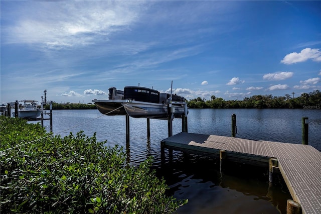 dock area featuring a water view and boat lift