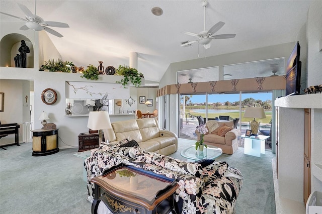 living room featuring carpet floors, ceiling fan, and high vaulted ceiling