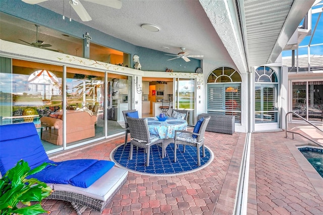 view of patio featuring a ceiling fan and outdoor dining space