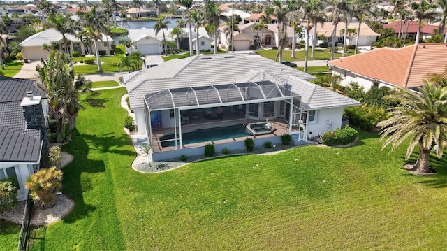 aerial view featuring a residential view and a water view