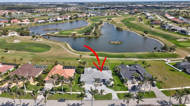 bird's eye view featuring view of golf course, a water view, and a residential view