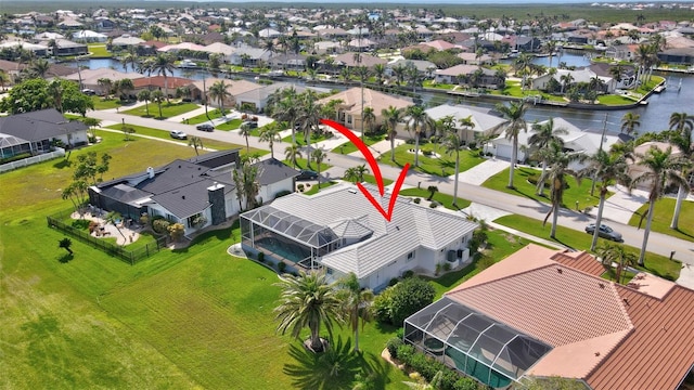 aerial view featuring a water view and a residential view