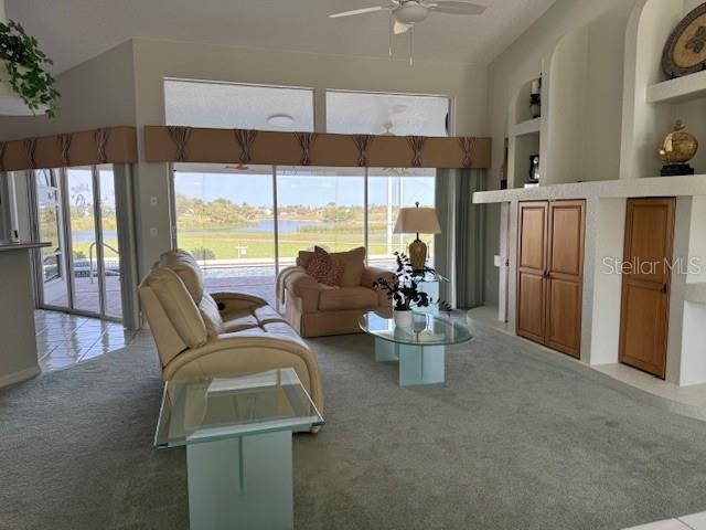 507 Monaco Dr, Punta Gorda, FL 33950 - living area with light colored carpet and ceiling fan