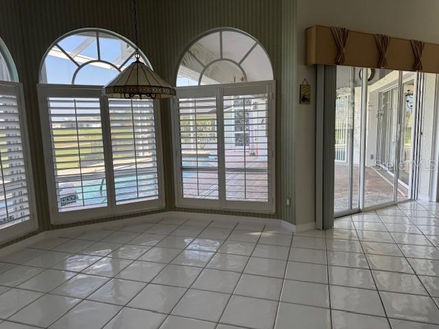 507 Monaco Dr, Punta Gorda, FL 33950 - unfurnished dining area featuring light tile patterned floors and baseboards