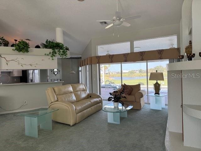 507 Monaco Dr, Punta Gorda, FL 33950 - carpeted living area with ceiling fan, a water view, and vaulted ceiling