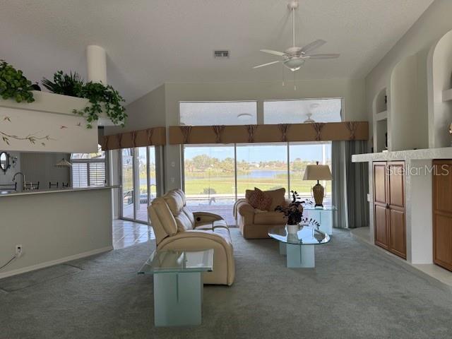 507 Monaco Dr, Punta Gorda, FL 33950 - living room with light carpet, ceiling fan, and baseboards