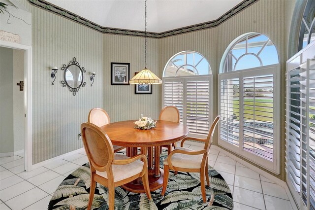 507 Monaco Dr, Punta Gorda, FL 33950 - dining room with light tile patterned flooring, wallpapered walls, and baseboards