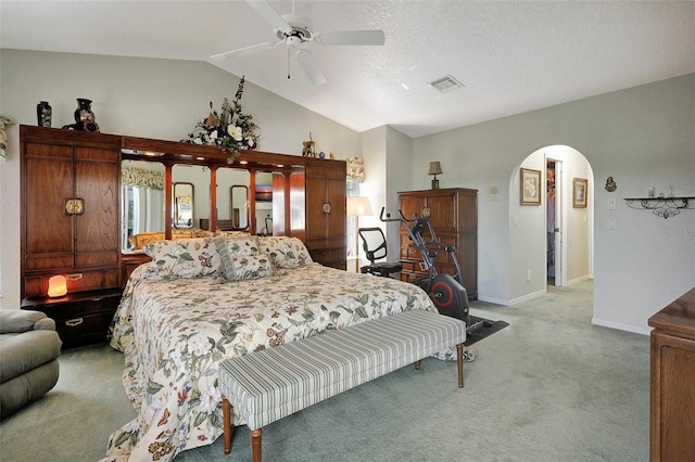 507 Monaco Dr, Punta Gorda, FL 33950 - bedroom featuring arched walkways, light carpet, lofted ceiling, baseboards, and a ceiling fan