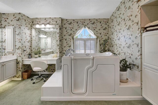 507 Monaco Dr, Punta Gorda, FL 33950 - bathroom featuring wallpapered walls, a textured ceiling, and a bathtub