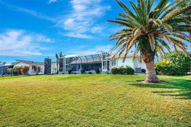 507 Monaco Dr, Punta Gorda, FL 33950 - rear view of house with a yard, stucco siding, and a lanai